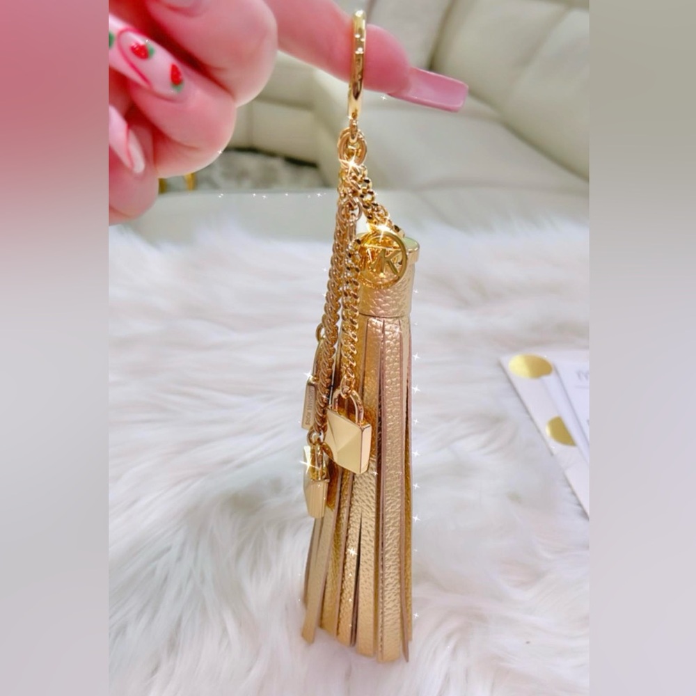 Michael Kors gold tassel charm keychain